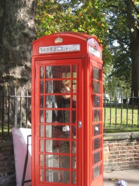 Joan in phone kiosk