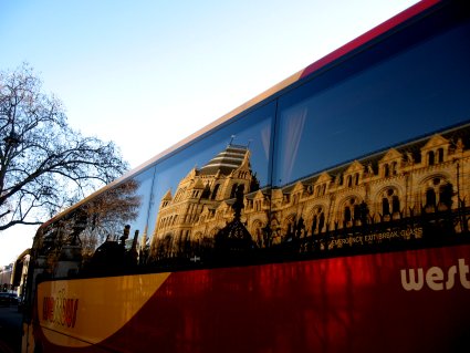 Museum reflected in a tourbus window