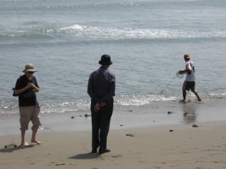 Fisherman and tourists